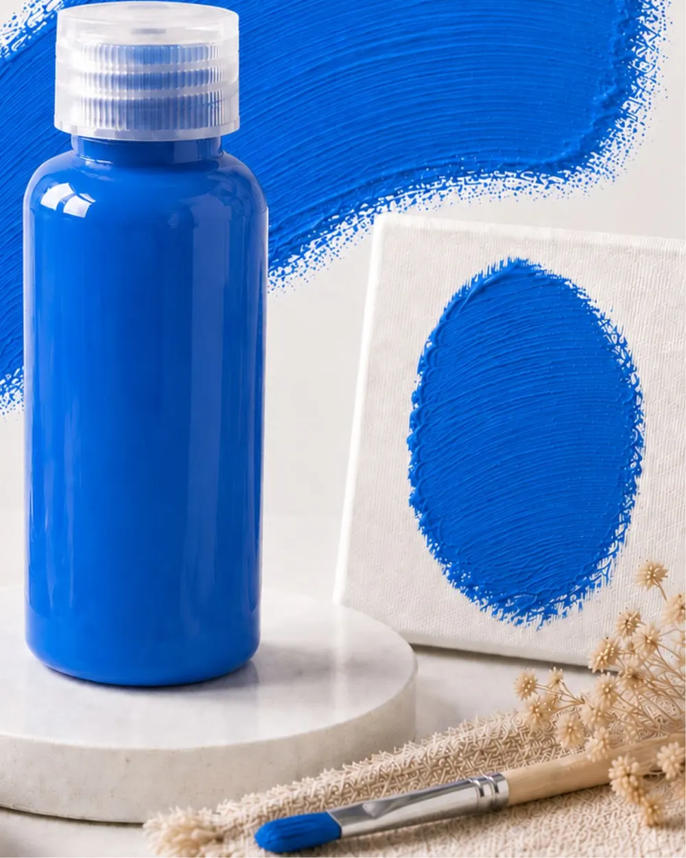 Botol Moritsu Student Acrylic Paint 100 ml warna Cerulean Blue di depan sapuan cat biru